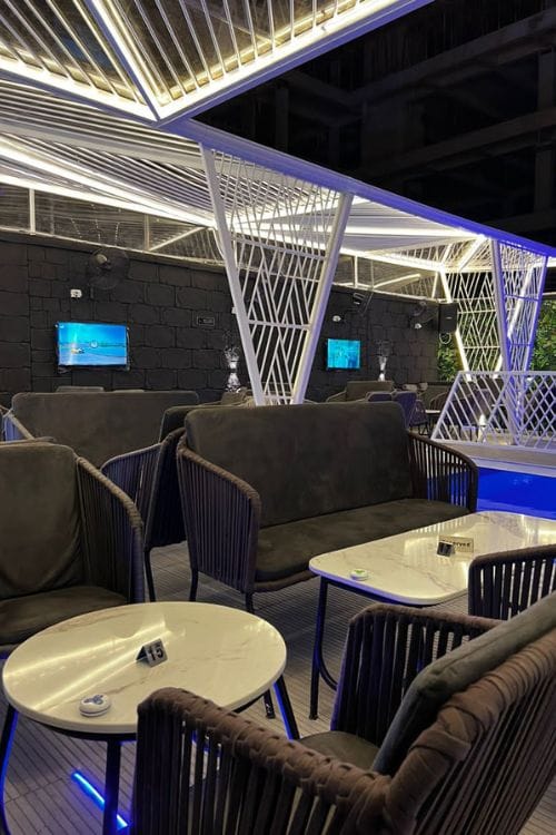 Modern lounge environment featuring plush seating and cozy atmospheric décor by DecorEffect Lagos.