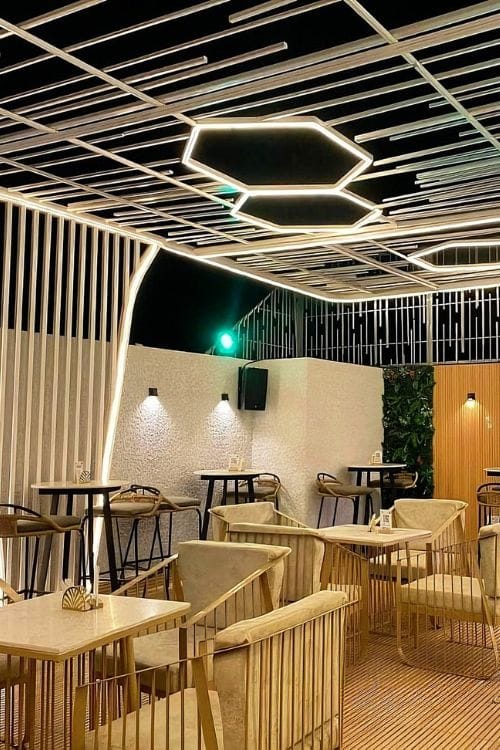 Modern lounge environment featuring plush seating and cozy atmospheric décor with ambient lighting by DecorEffect Lagos.